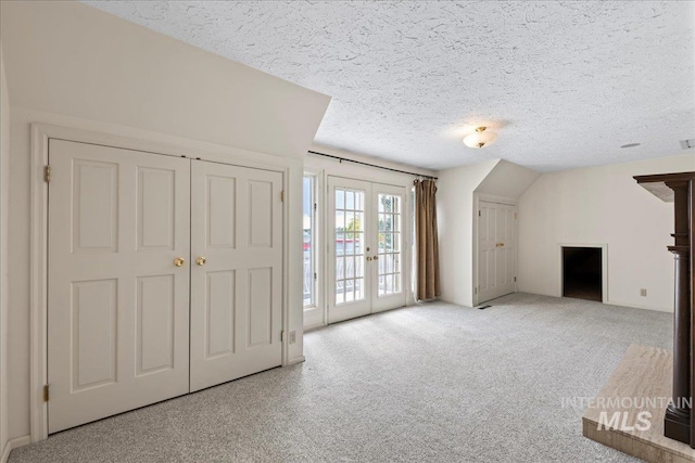905 S Canyon St, Nampa, ID 83686 - additional living space featuring french doors, a textured ceiling, and carpet flooring