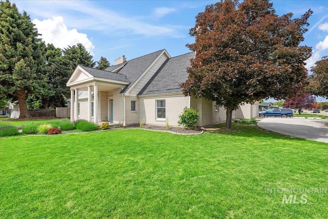 905 S Canyon St, Nampa, ID 83686 - greek revival inspired property featuring brick siding, a chimney, and roof with shingles