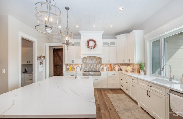 14050 Hidalgo Ranch Pl, Nampa, ID 83651 - kitchen with recessed lighting, appliances with stainless steel finishes, a sink, and light wood-type flooring