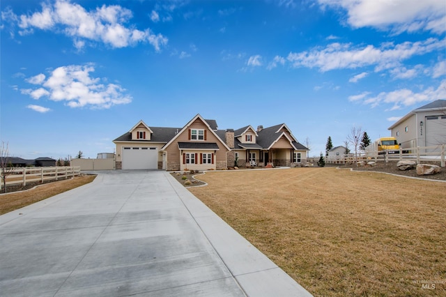 14050 Hidalgo Ranch Pl, Nampa, ID 83651 - craftsman-style home featuring fence, stone siding, a garage, a front yard, and concrete driveway