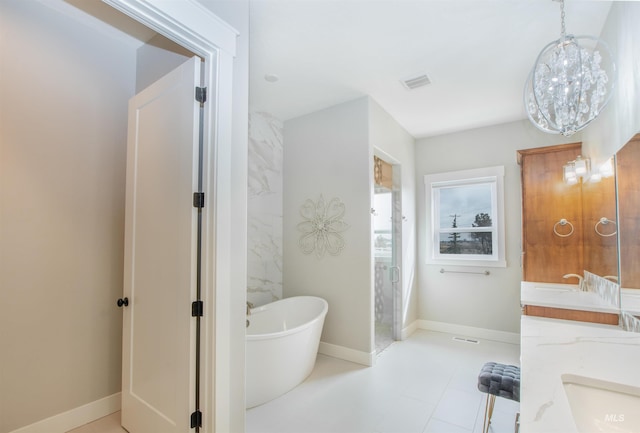 14050 Hidalgo Ranch Pl, Nampa, ID 83651 - full bathroom with double vanity, baseboards, visible vents, and a soaking tub