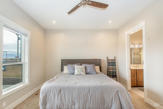 14050 Hidalgo Ranch Pl, Nampa, ID 83651 - bedroom featuring baseboards, ensuite bath, multiple windows, and light carpet