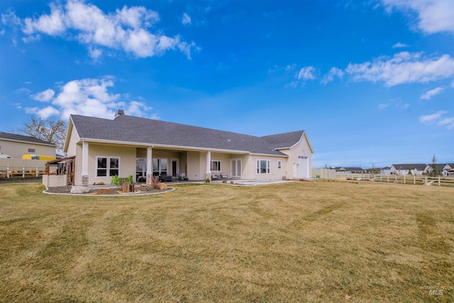 14050 Hidalgo Ranch Pl, Nampa, ID 83651 - rear view of house with fence, a yard, and a patio area