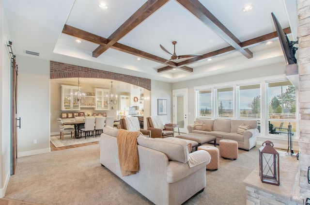 14050 Hidalgo Ranch Pl, Nampa, ID 83651 - living area featuring visible vents, beam ceiling, baseboards, coffered ceiling, and ceiling fan with notable chandelier