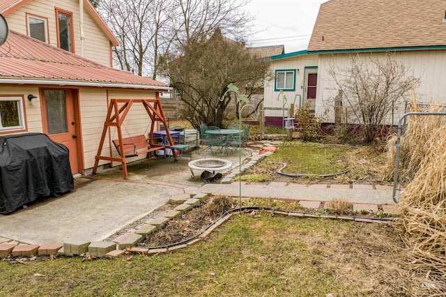 view of yard featuring a patio area and a fire pit