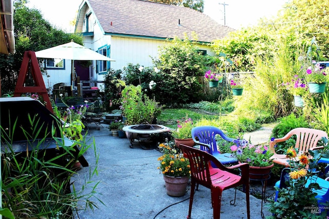 view of patio featuring a fire pit