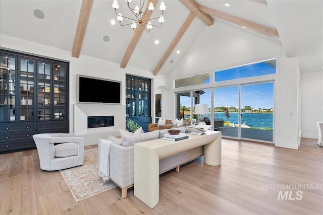 938 S Waning Ln, Eagle, ID 83616 - living room featuring high vaulted ceiling, beamed ceiling, a chandelier, light wood finished floors, and recessed lighting