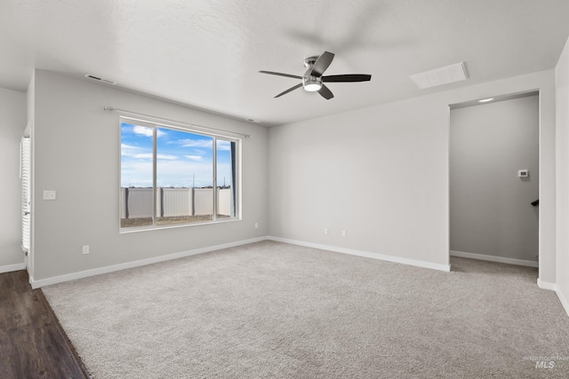 unfurnished room with visible vents, baseboards, and ceiling fan