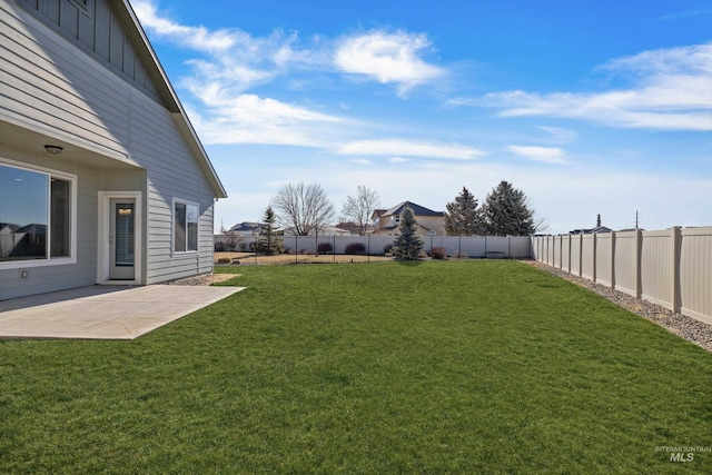 view of yard with a patio area and a fenced backyard