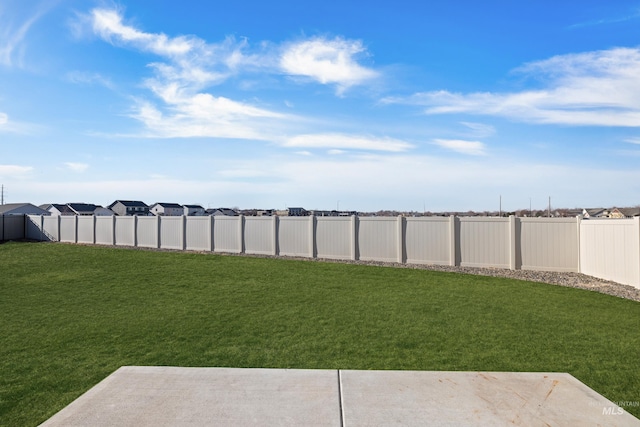 view of yard with a fenced backyard