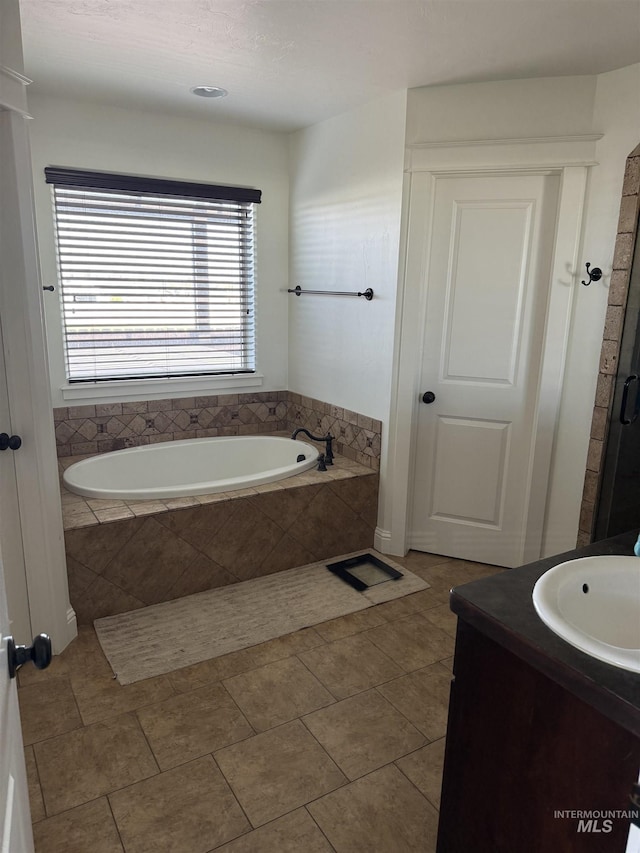 2486 E 3745, Twin Falls, ID 83301 - bathroom with vanity, tile patterned floors, and a garden tub