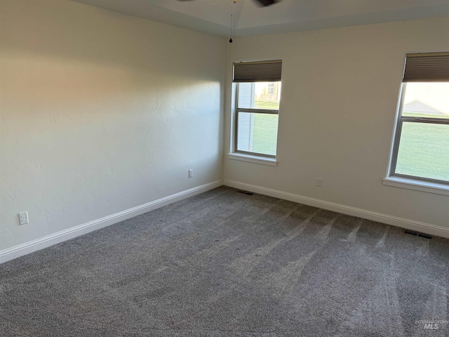 2486 E 3745, Twin Falls, ID 83301 - empty room with a ceiling fan, baseboards, visible vents, and dark colored carpet
