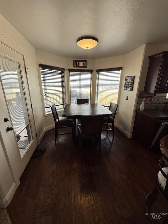 2486 E 3745, Twin Falls, ID 83301 - dining room with baseboards and dark wood-style flooring