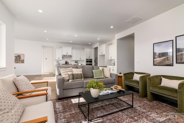 living room featuring dark hardwood / wood-style floors