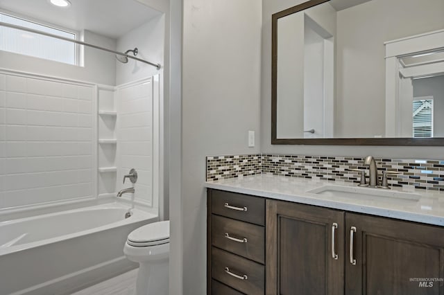 full bathroom with bathing tub / shower combination, decorative backsplash, vanity, and toilet