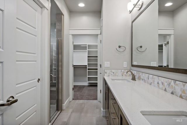 bathroom with vanity and an enclosed shower