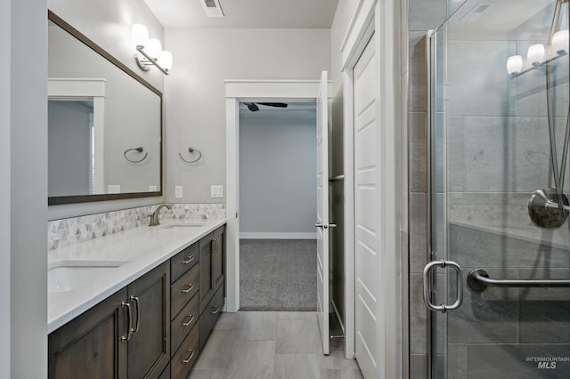 bathroom featuring vanity and an enclosed shower