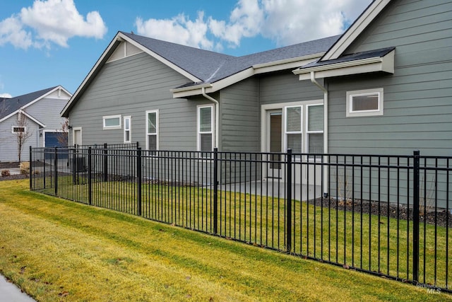 view of property exterior featuring a lawn