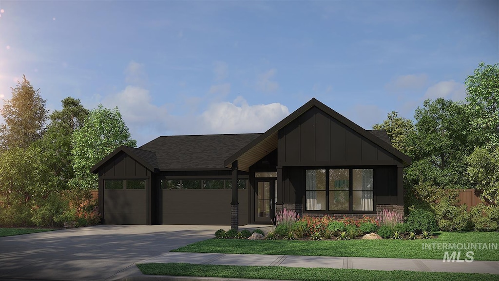 view of front of property featuring a front lawn, driveway, board and batten siding, and a garage