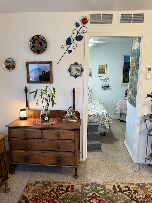 bedroom featuring light colored carpet