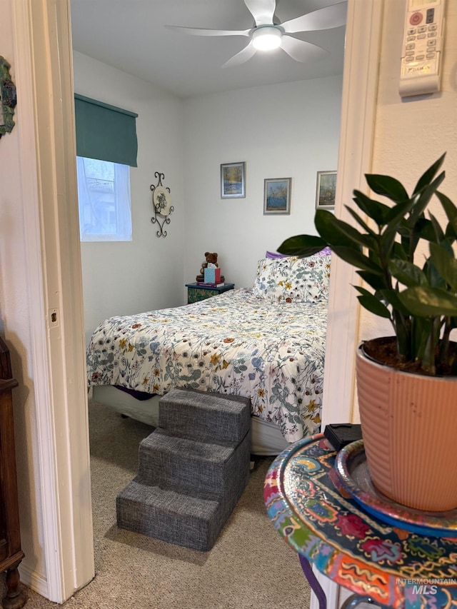 bedroom with ceiling fan and carpet