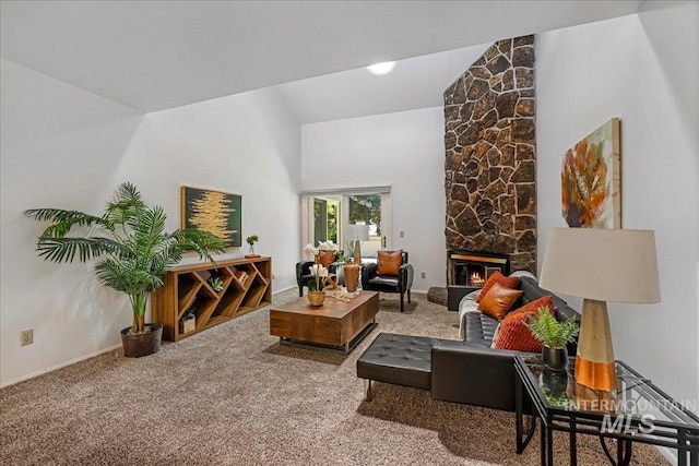 300 Morrison Unit 643, Twin Falls, ID 83301 - living room featuring carpet floors, a stone fireplace, baseboards, and high vaulted ceiling