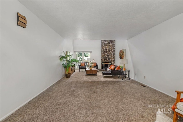 300 Morrison Unit 643, Twin Falls, ID 83301 - living area with a fireplace, carpet, baseboards, and a textured ceiling