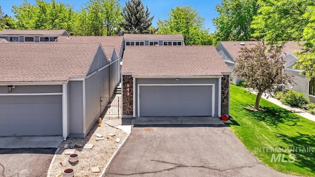 300 Morrison Unit 643, Twin Falls, ID 83301 - mid-century modern home with a garage and a shingled roof