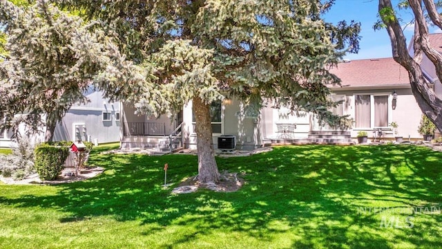 300 Morrison Unit 643, Twin Falls, ID 83301 - back of house featuring cooling unit and a lawn
