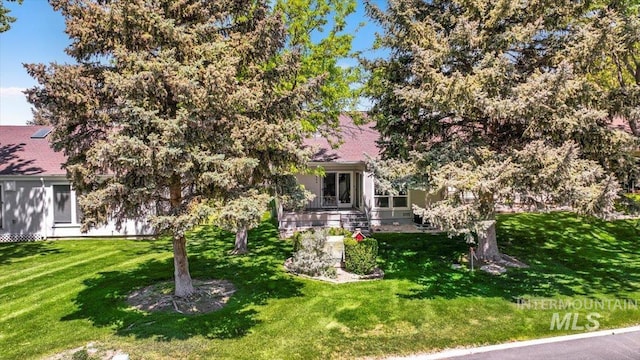300 Morrison Unit 643, Twin Falls, ID 83301 - view of property hidden behind natural elements with a front yard and a shingled roof