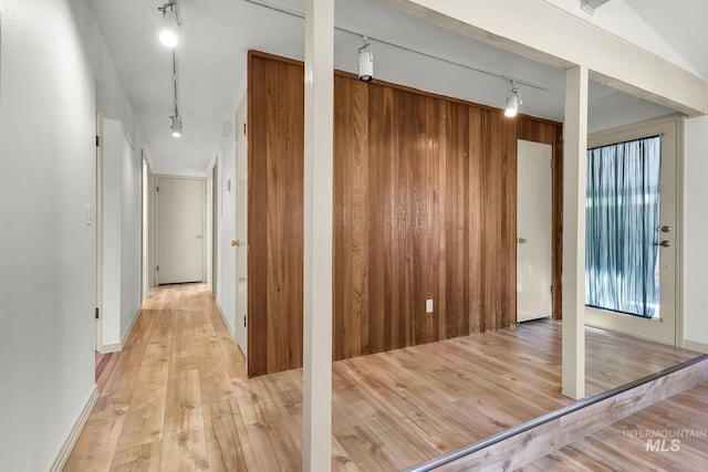 corridor featuring track lighting and light wood-type flooring