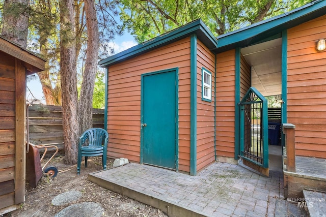 view of outdoor structure with fence
