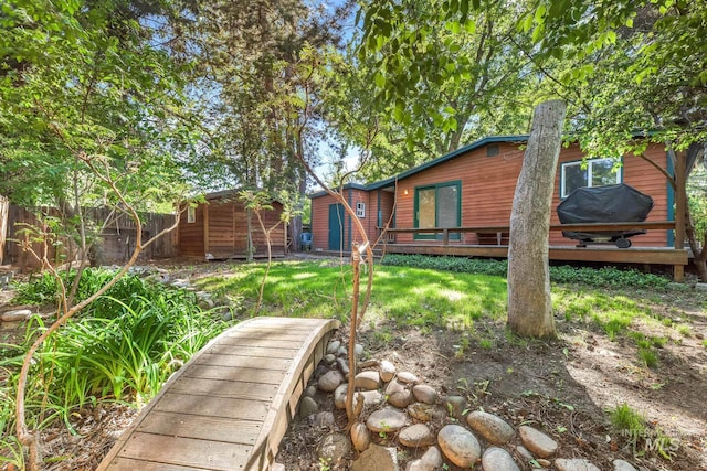 view of yard featuring a wooden deck