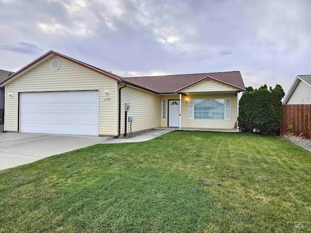 single story home with a garage and a front yard