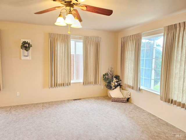 unfurnished room featuring carpet flooring and ceiling fan