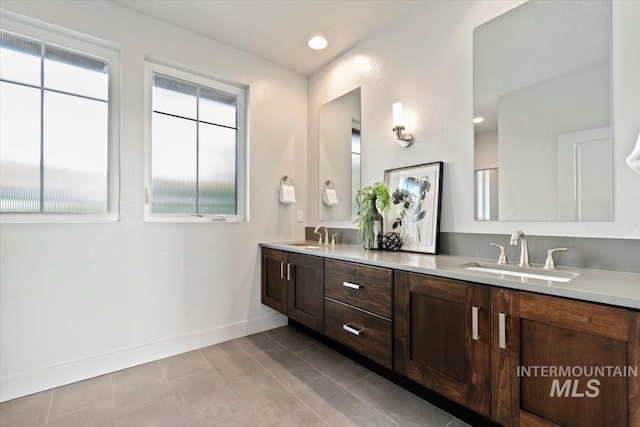 5085 S Taboo Pl, Boise, ID 83716 - full bath with double vanity, baseboards, and tile patterned floors