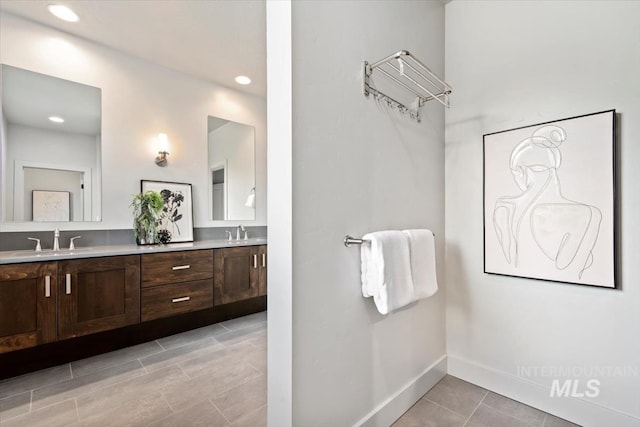 5085 S Taboo Pl, Boise, ID 83716 - full bathroom featuring double vanity, baseboards, tile patterned flooring, and recessed lighting