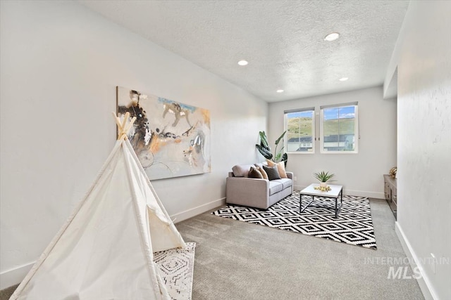 5085 S Taboo Pl, Boise, ID 83716 - living area with carpet, a textured ceiling, baseboards, and recessed lighting