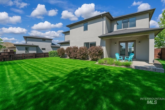 5085 S Taboo Pl, Boise, ID 83716 - rear view of property featuring stucco siding and a patio