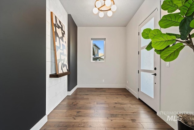 5085 S Taboo Pl, Boise, ID 83716 - foyer featuring hardwood / wood-style floors, a chandelier, and baseboards