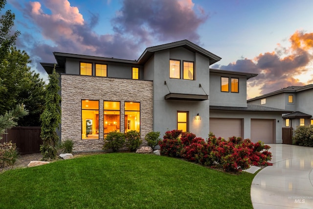 5085 S Taboo Pl, Boise, ID 83716 - view of front facade with stone siding, driveway, a garage, and stucco siding