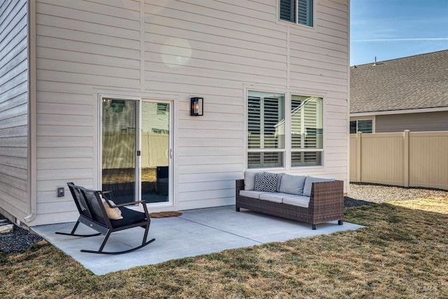 rear view of house with an outdoor living space, a patio area, a yard, and fence