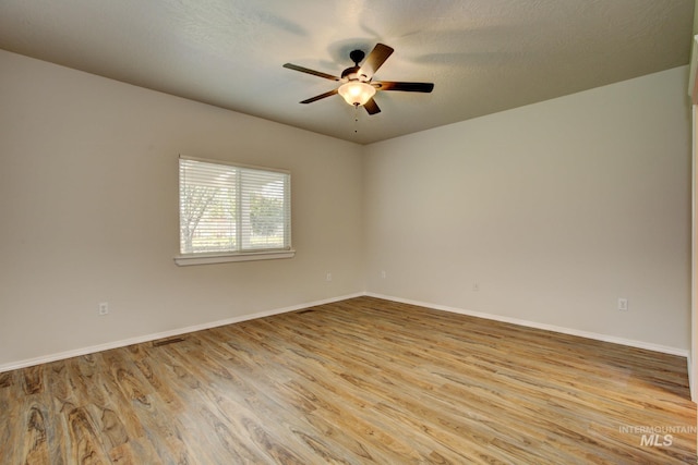 2853 N High Desert Way, Meridian, ID 83646 - spare room with ceiling fan, wood finished floors, and baseboards