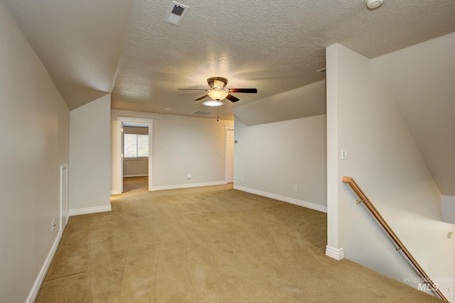 2853 N High Desert Way, Meridian, ID 83646 - bonus room with light colored carpet, a ceiling fan, a textured ceiling, and baseboards
