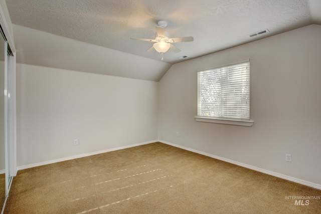 2853 N High Desert Way, Meridian, ID 83646 - bonus room with carpet, lofted ceiling, a ceiling fan, a textured ceiling, and baseboards
