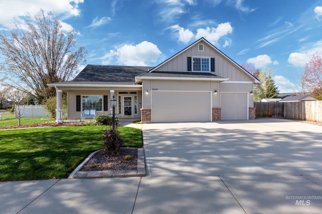 2853 N High Desert Way, Meridian, ID 83646 - craftsman-style home featuring board and batten siding, concrete driveway, a porch, brick siding, and an attached garage
