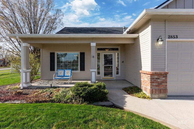 2853 N High Desert Way, Meridian, ID 83646 - entrance to property featuring a porch, a garage, roof with shingles, and a yard