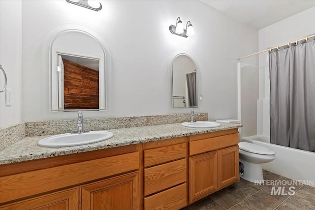 full bathroom with vanity, toilet, and shower / tub combo with curtain