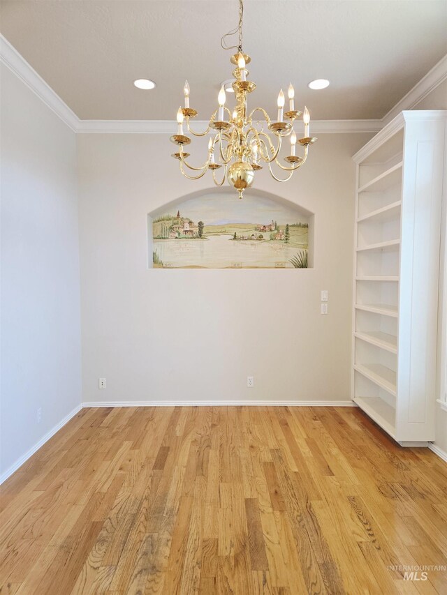 1203 Tara Ct, Fruitland, ID 83619 - spare room with crown molding, recessed lighting, a notable chandelier, and wood finished floors