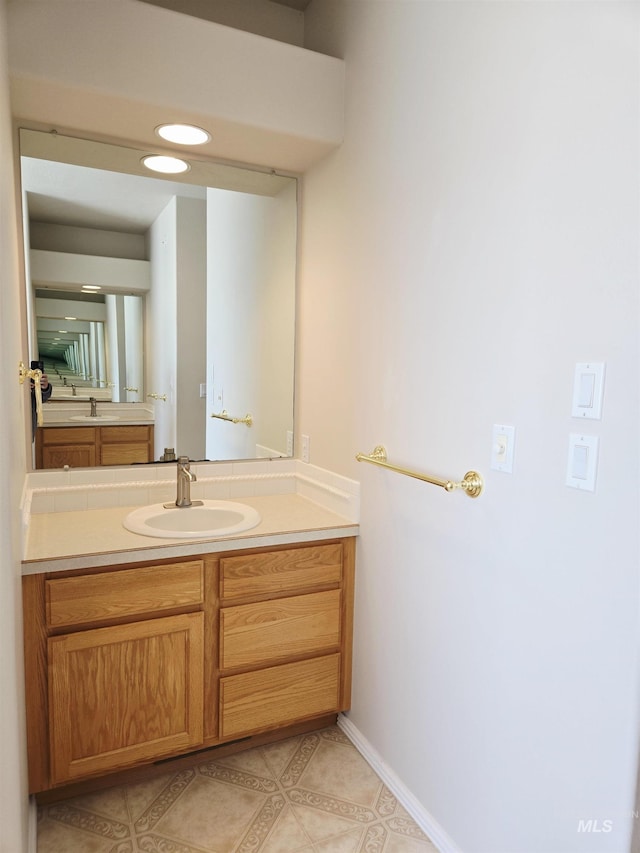 1203 Tara Ct, Fruitland, ID 83619 - bathroom featuring vanity, baseboards, and tile patterned floors